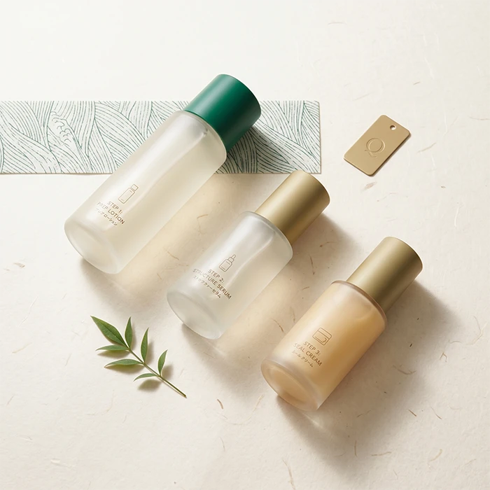 Qpolaris skincare bottles and jars displayed in a quiet luxury setting